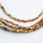 COLLAR PECES GRANATE VERDE FACETADO: El Resplandor Profundo del Océano