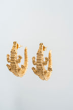 COCODRILO: El guardián dorado que evoca la sabiduría de las aguas.