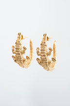 COCODRILO: El guardián dorado que evoca la sabiduría de las aguas.