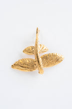 VOLITANS: El aleteo dorado que adorna tu oído.